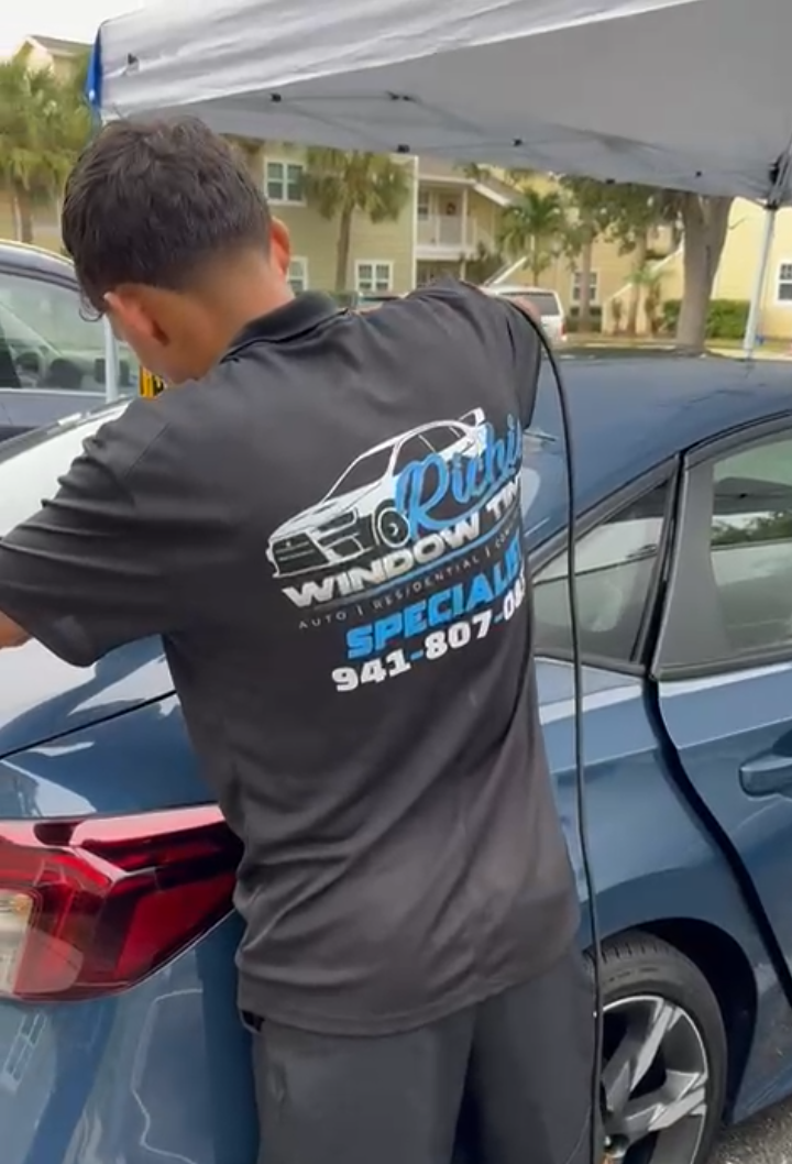Richard working on window tint installation